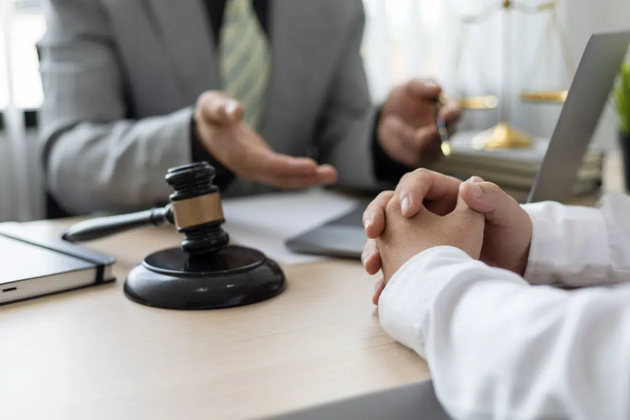 Marijuana dui attorney consultation with gavel and scales visible on the table.