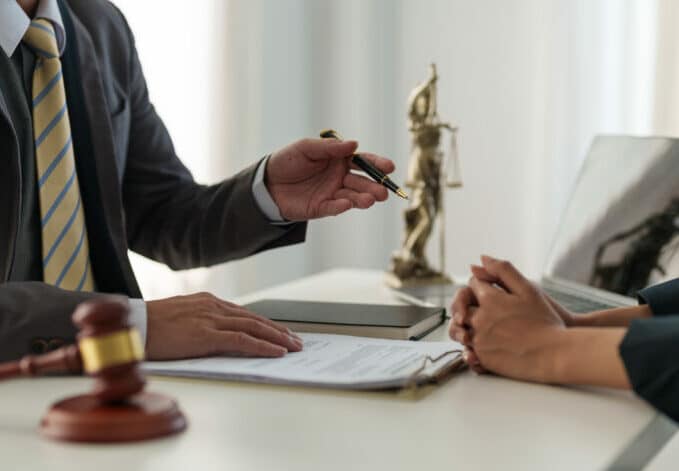 Businesswoman and lawyer adviser discuss the contract agreement document. Treaty of the law. sign a contract business concept.